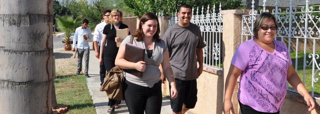 AmeriCorps Member Jenna and residents Sergio and Yvonne led Rebecca Hix and staff through the Demeter Neighborhood 